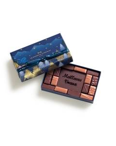 Coffret Meilleurs Voeux Vents de Noël 16 chocolats  semi-ouvert sur un fond blanc