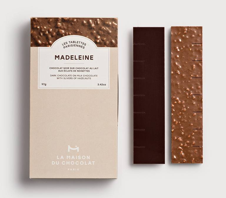 Madeleine milk chocolate bar with crushed hazelnuts and a layer of dark chocolate