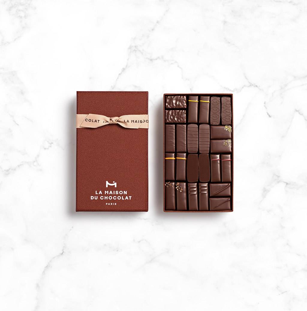 Maison Gift Box Dark 24 chocolates on marble background 