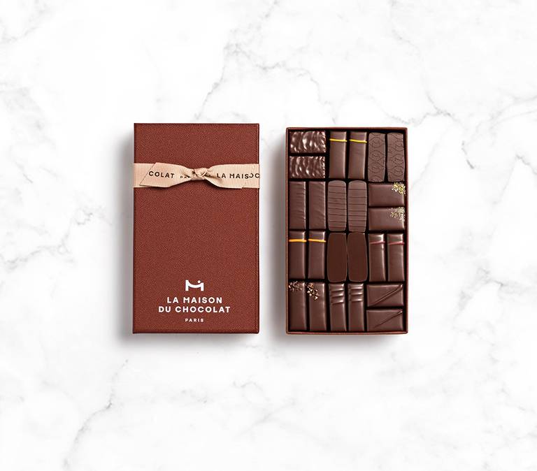 Maison Gift Box Dark 24 chocolates on marble background