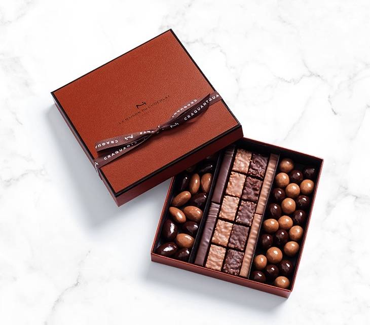 Find all the richness and delicacy of an assortment of chocolate covered almonds & hazelnuts as well as Rocher, hand made pralines with roasted nuts finely coated with dark and milk chocolate.