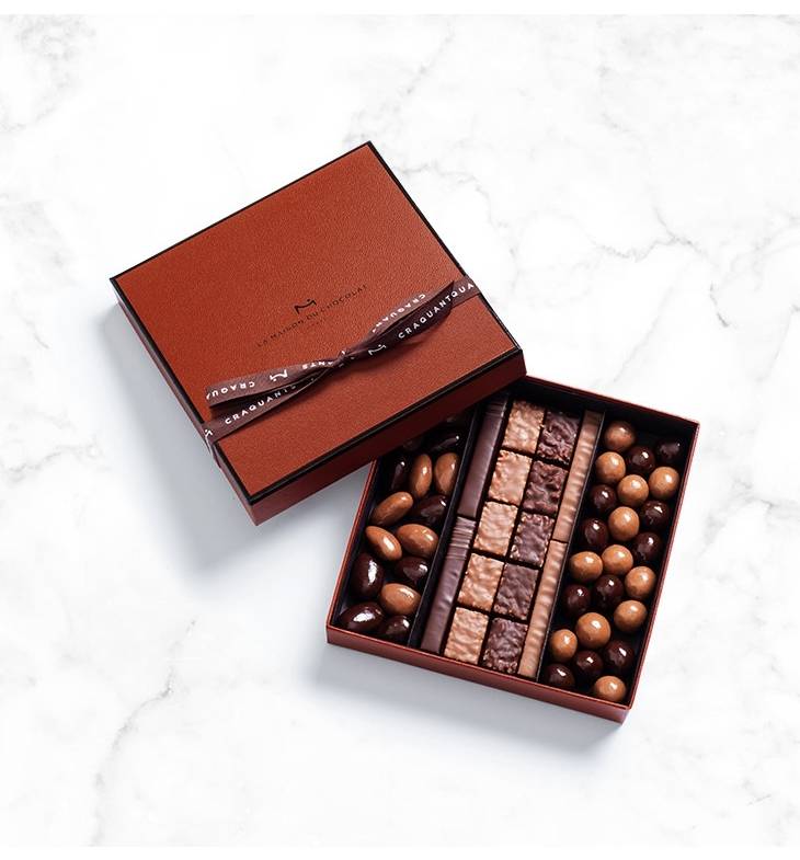 Find all the richness and delicacy of an assortment of chocolate covered almonds & hazelnuts as well as Rocher, hand made pralines with roasted nuts finely coated with dark and milk chocolate.