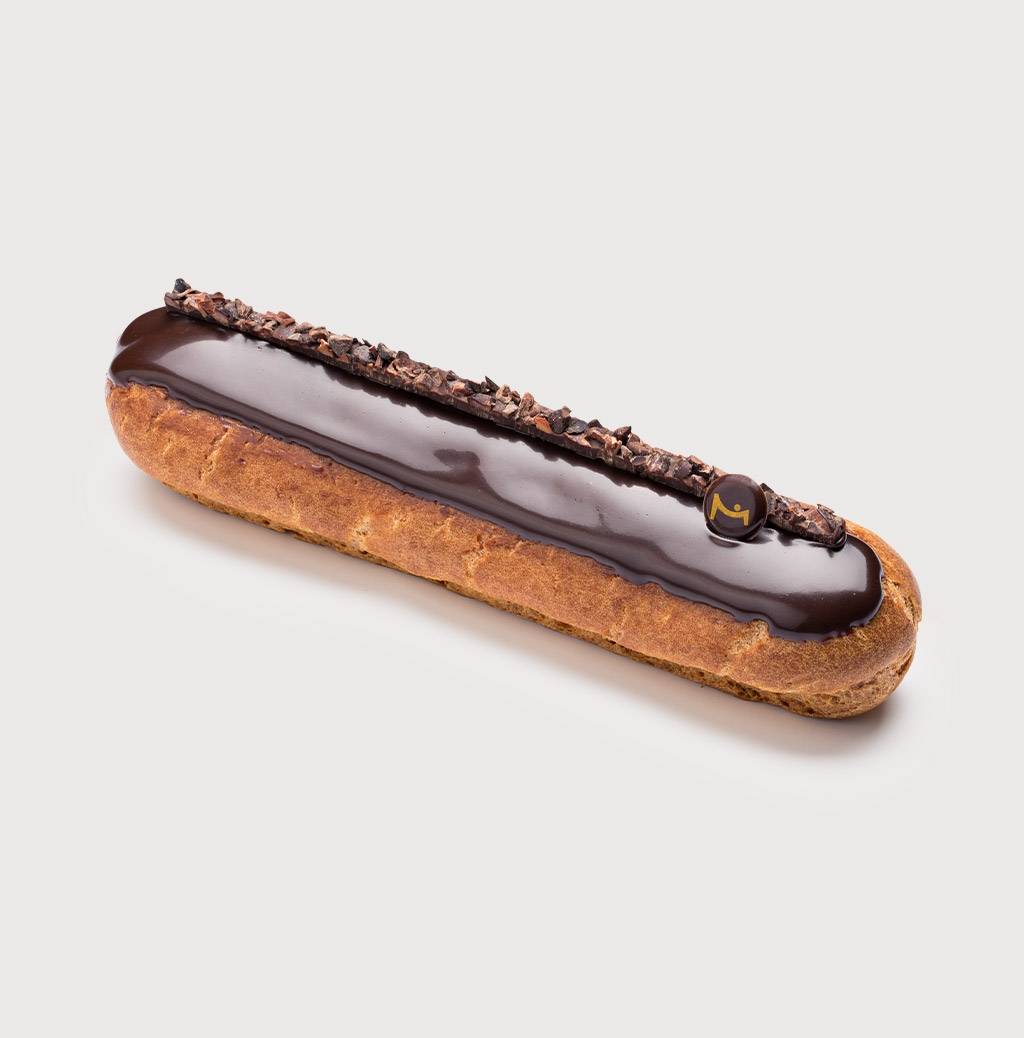 Dark Chocolate Eclair on a grey background