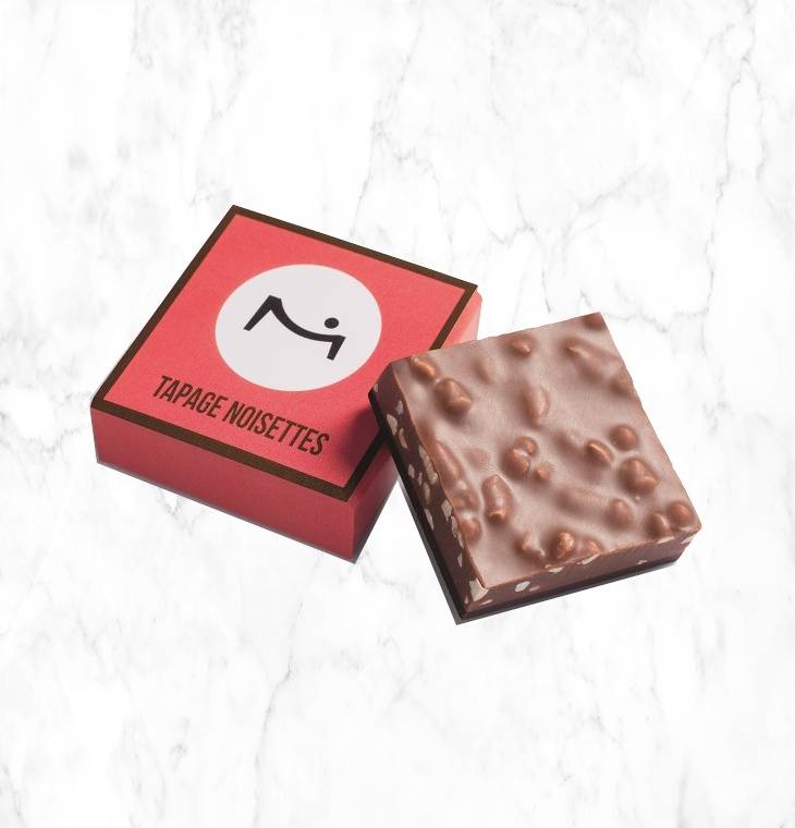 Unhinged Chocolate Square 8g on a marble background