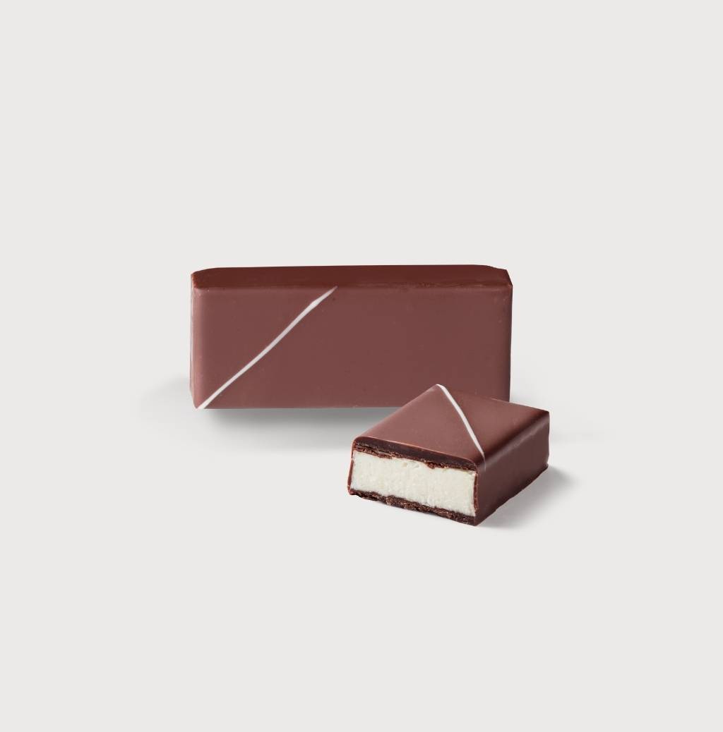 Coco Bouchée on a gray background