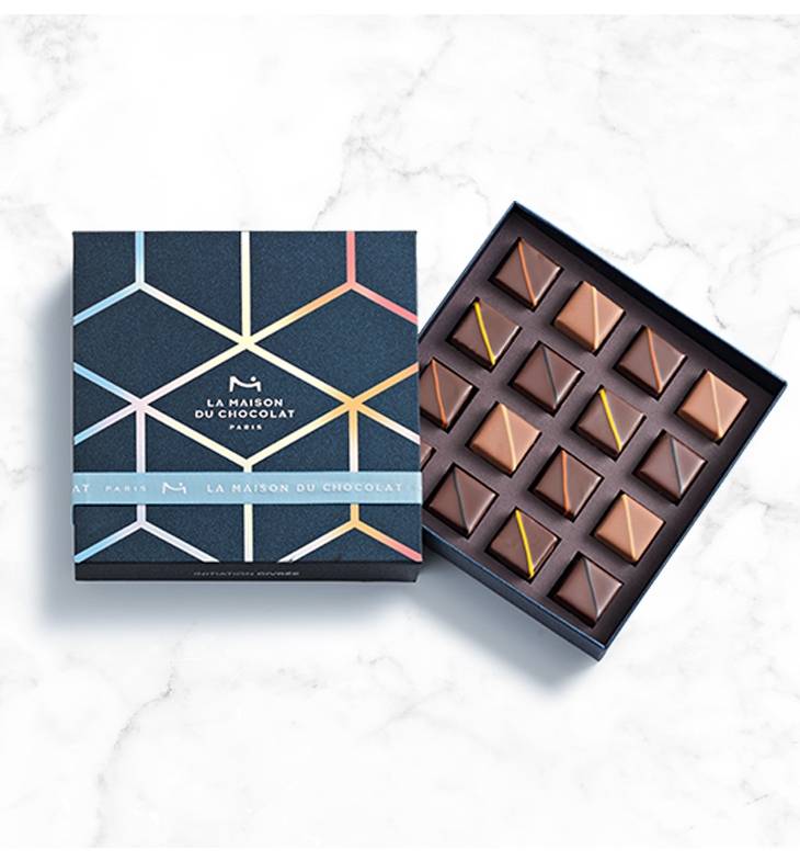 Winter Frosted Initiation Box 16 semi-open chocolates on a marble background