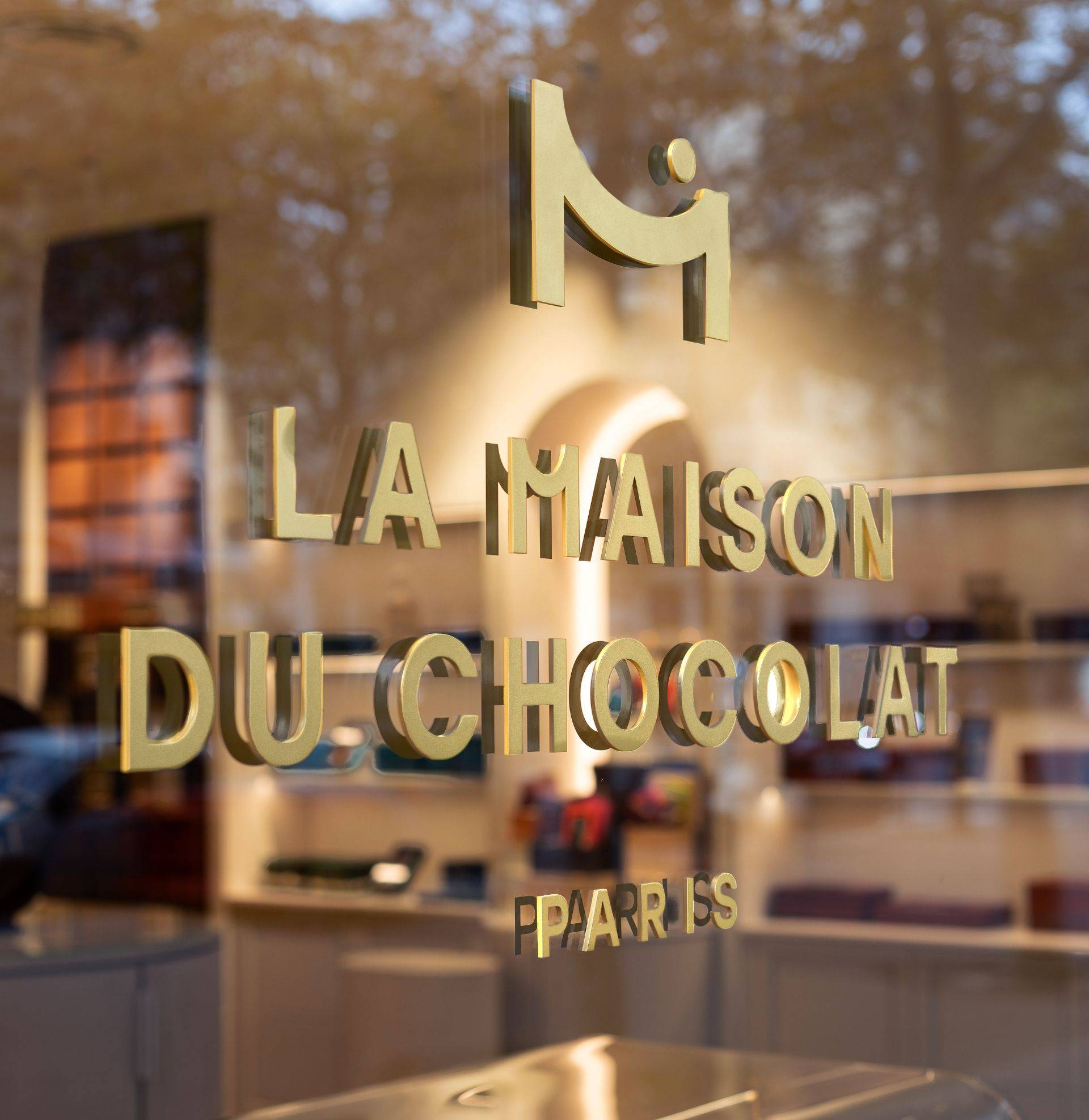 La Maison du Chocolat logo on a store window