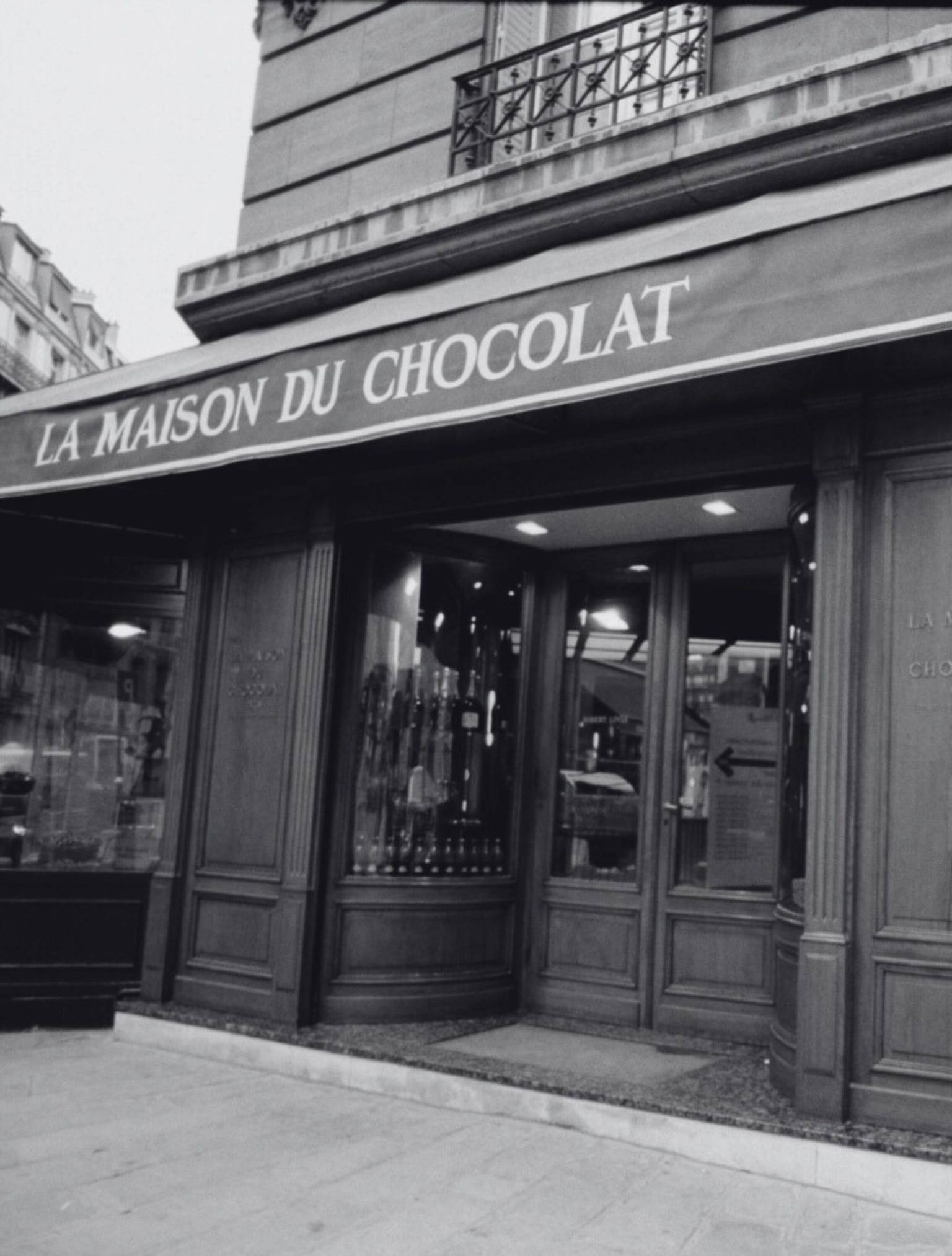 Black and white storefront of the first La Maison du Chocolat boutique