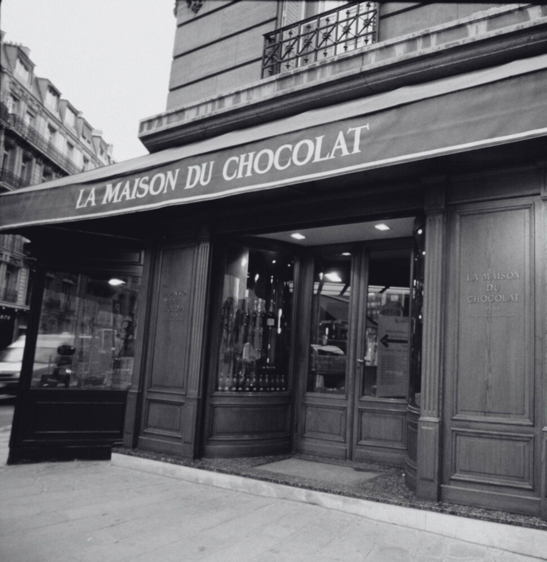 Black and white storefront of the first La Maison du Chocolat boutique