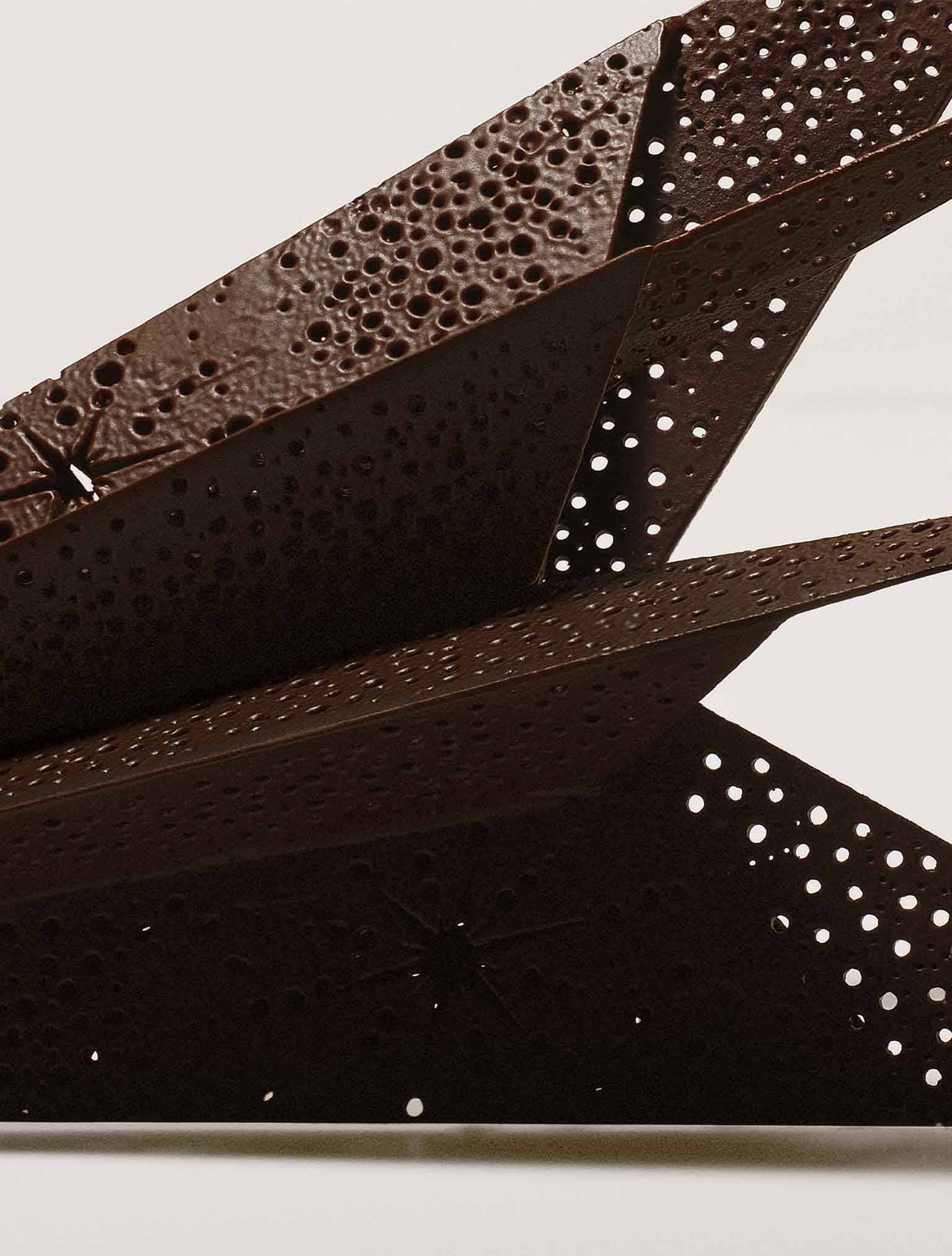 Close-up of a pierced chocolate piece