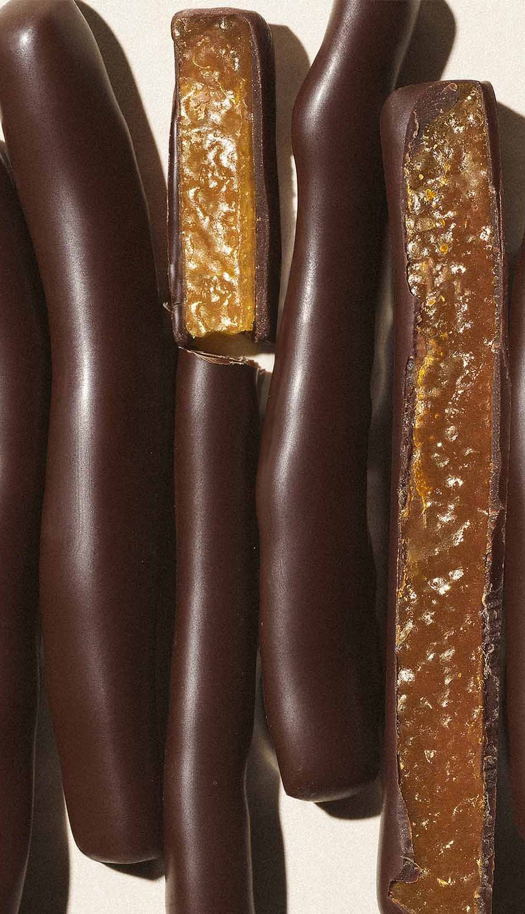 close up photo of candied orange peels covered in dark chocolate