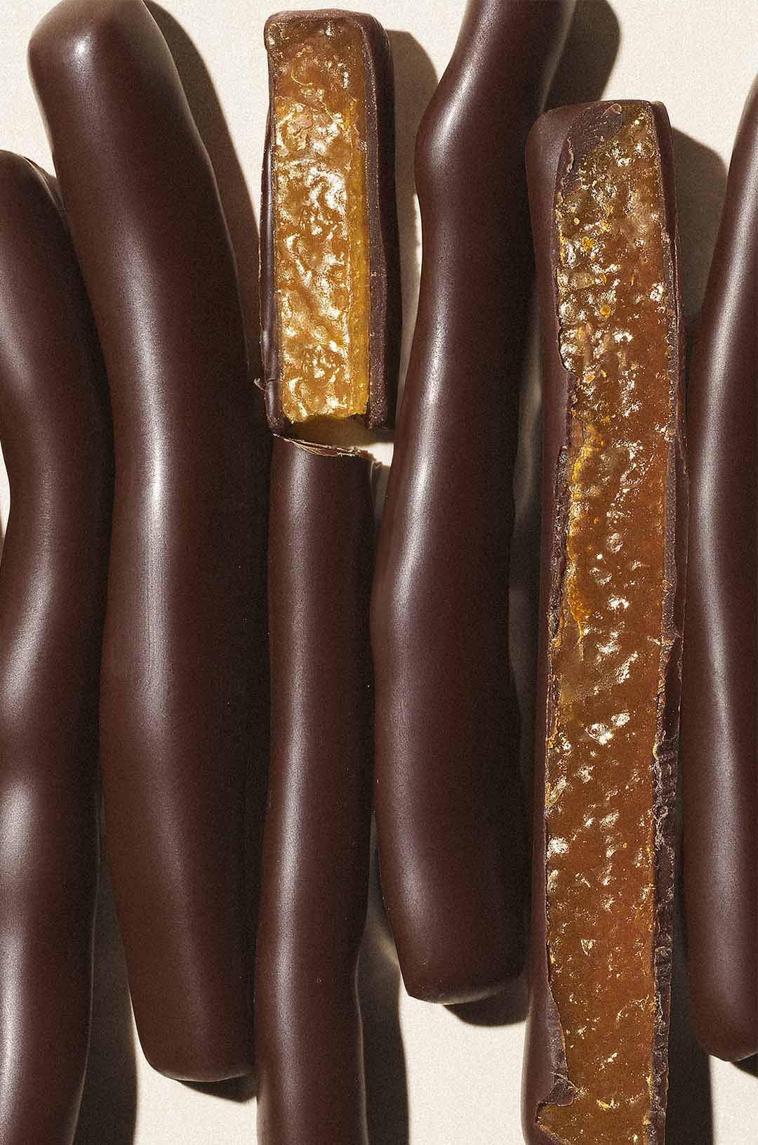 close up photo of candied orange peels covered in dark chocolate